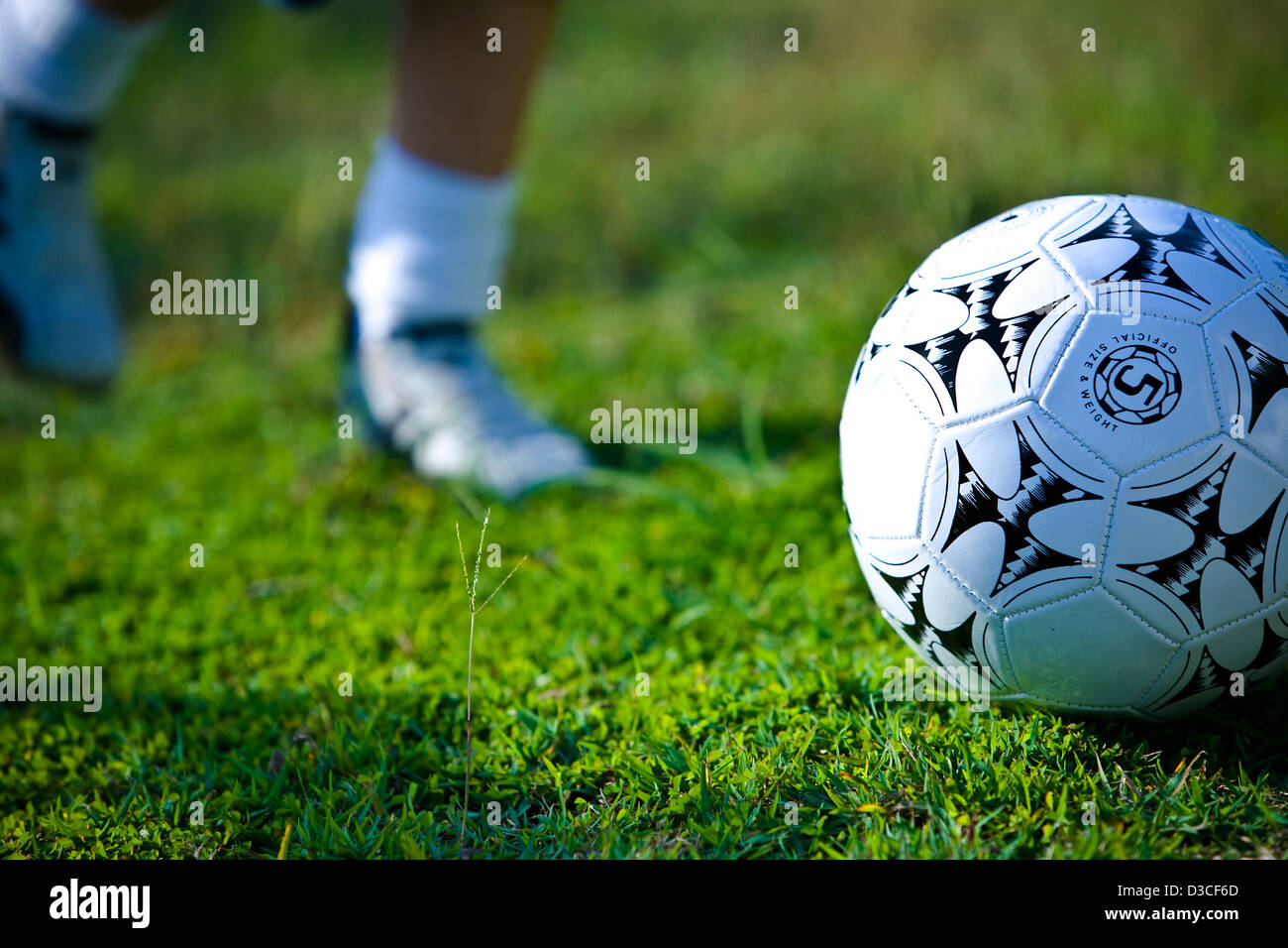 Sporting image of a person kicking a football Stock Photo