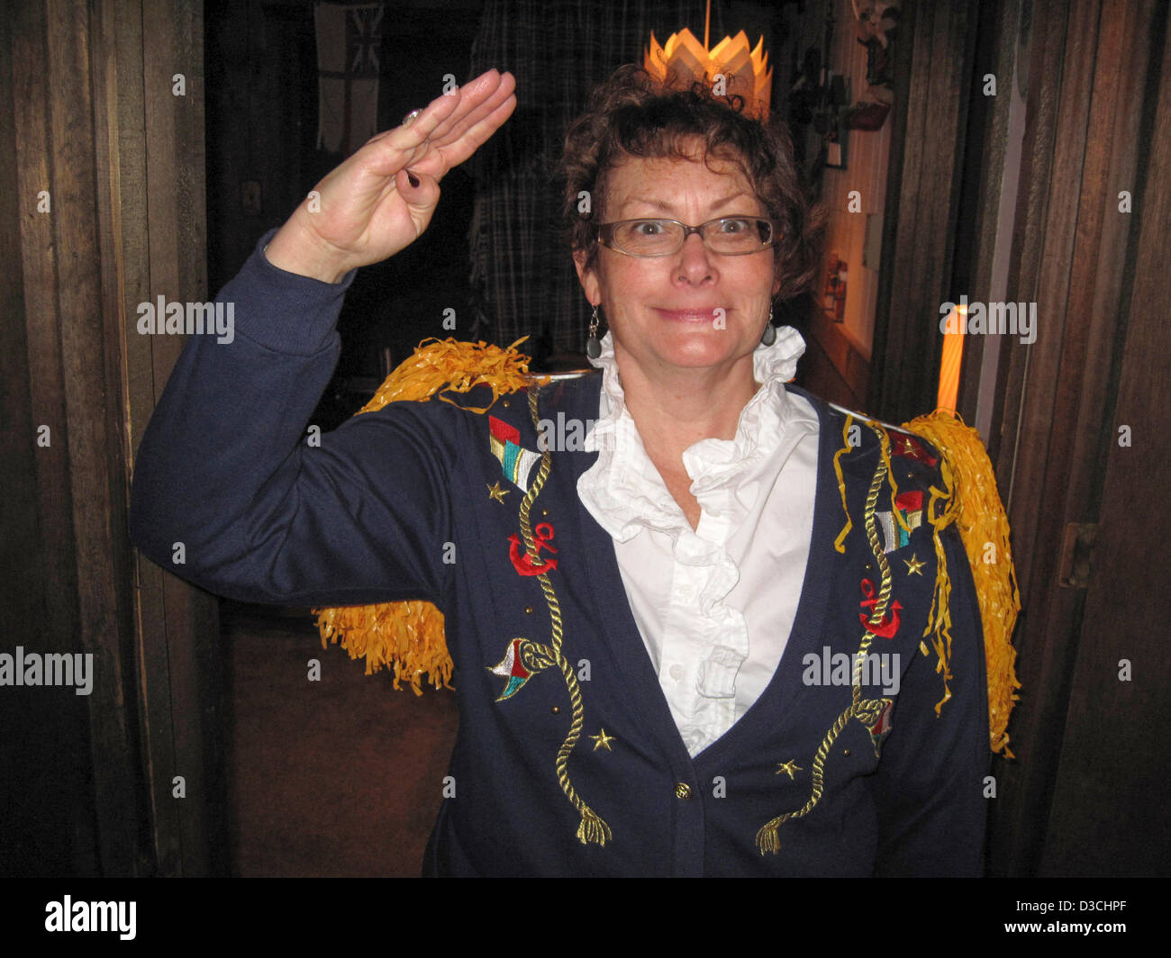 Commodore Annie Parcels saluting before a modern day rum Tot ceremony honoring Admiral Nelson of the Royal Navy, Ironwood Michigan MI Upper Peninsula U.P. USA, on Friday February 08, 2013. One of the many après-ski events which brings out hidden talents of many individuals. Stock Photo
