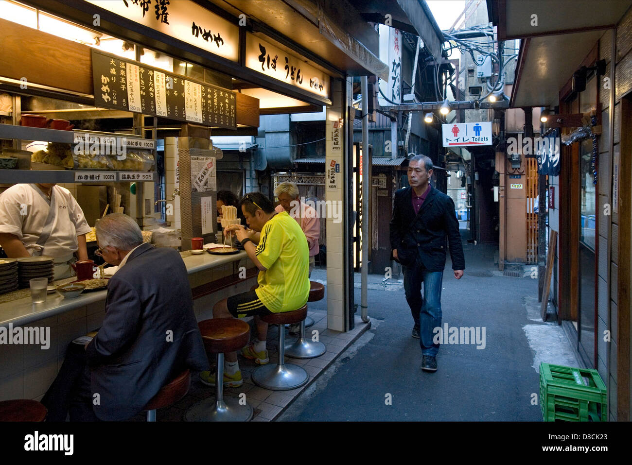 Unchanged since 1950's a narrow alley called Omoide Yokocho, or Memory Lane, in Shinjuku, Tokyo is packed with small restaurants Stock Photo