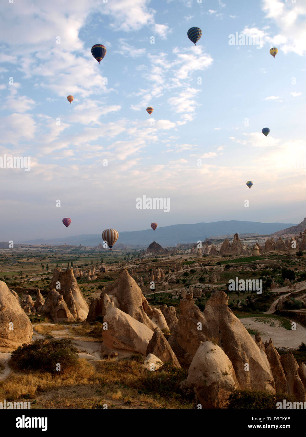 Hot air balloons flying over Cappadocia (Kapadokya), Nevsehir Province, Turkey, as World Heritage Site by UNESCO Stock Photo