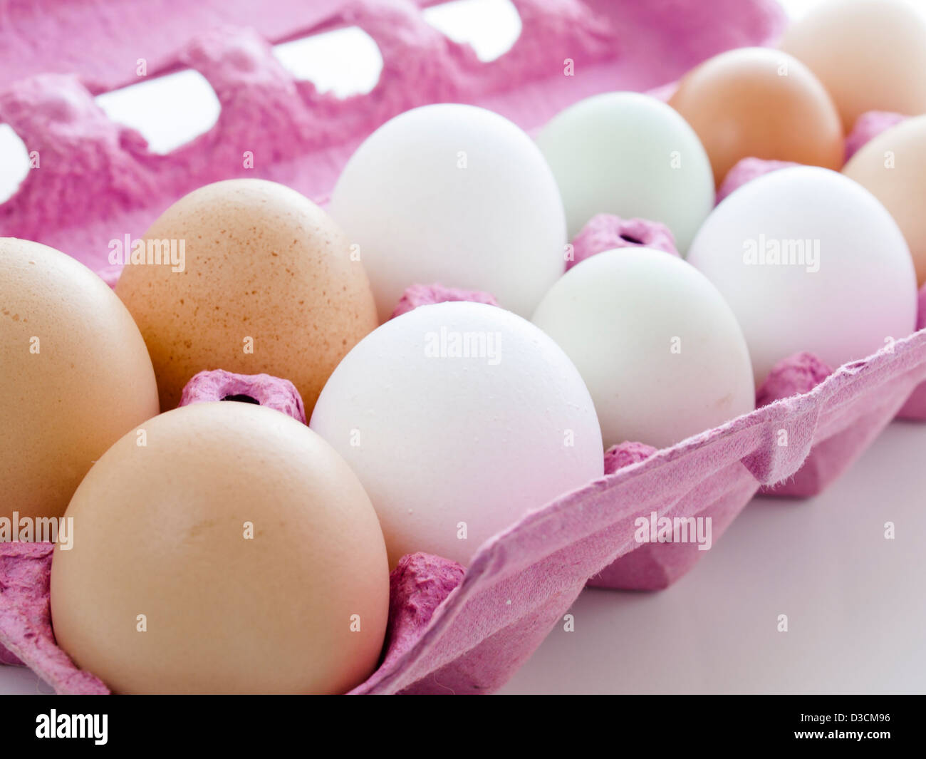 Fresh farm eggs in pink egg crate Stock Photo Alamy