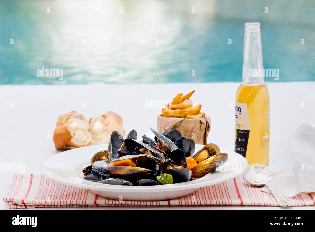 Plate of fresh mussels and a Corona Stock Photo
