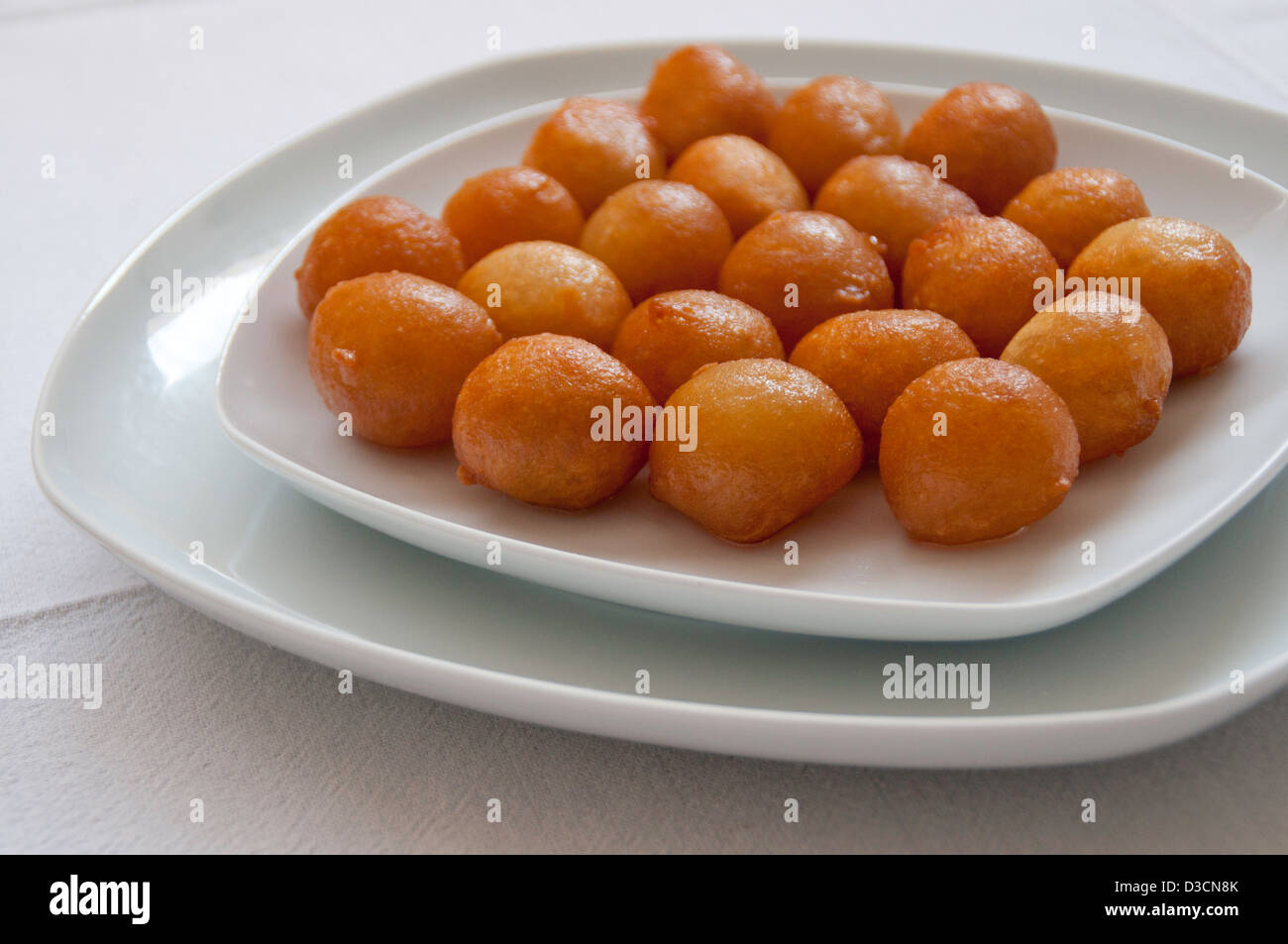 Frieddough pastry made of deep fried dough soaked in sugar syrup or