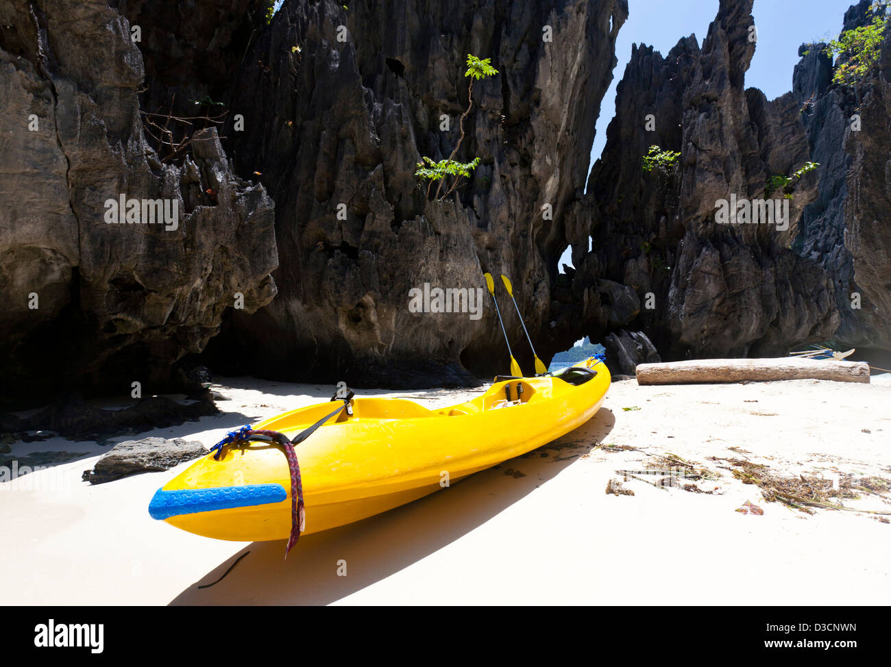 Yellow canoe on the beach Stock Photo