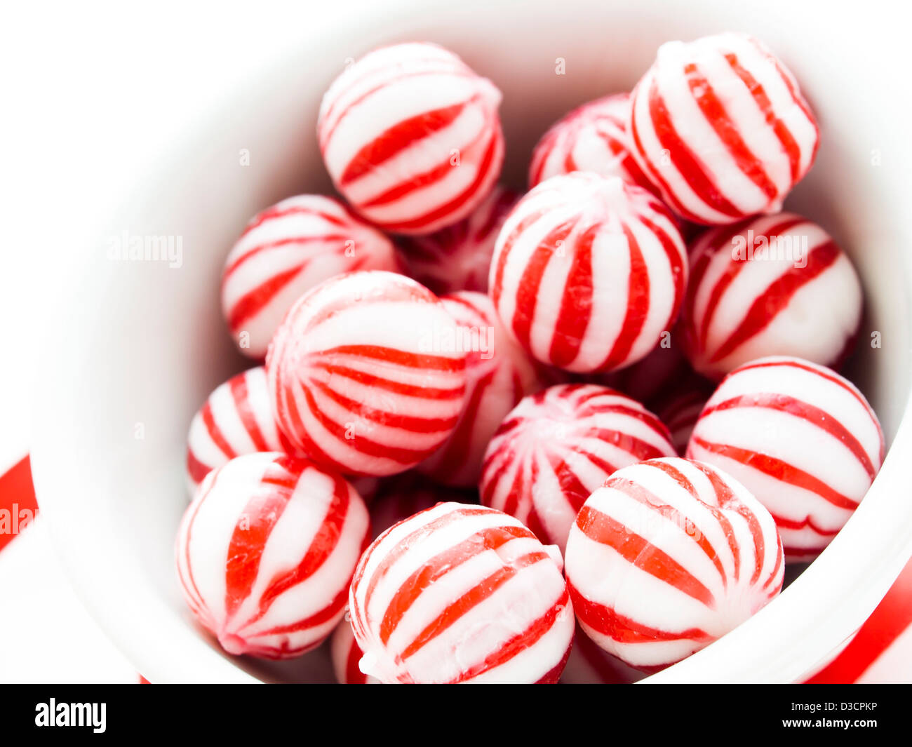 Gourmet white and red peppermint candies on white background Stock ...