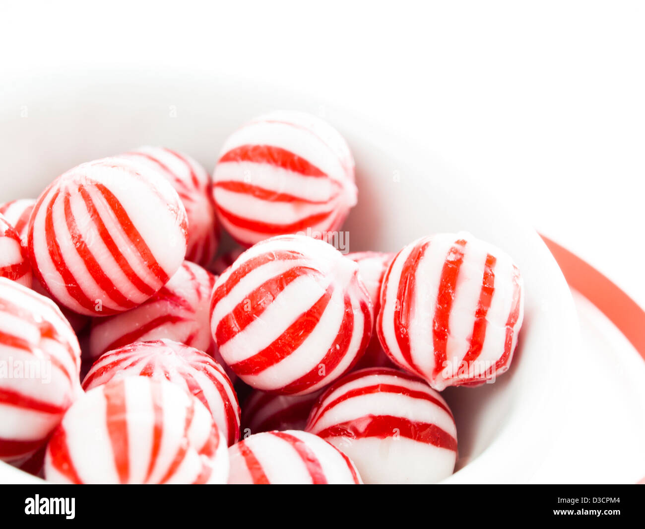 Gourmet white and red peppermint candies on white background Stock Photo Alamy