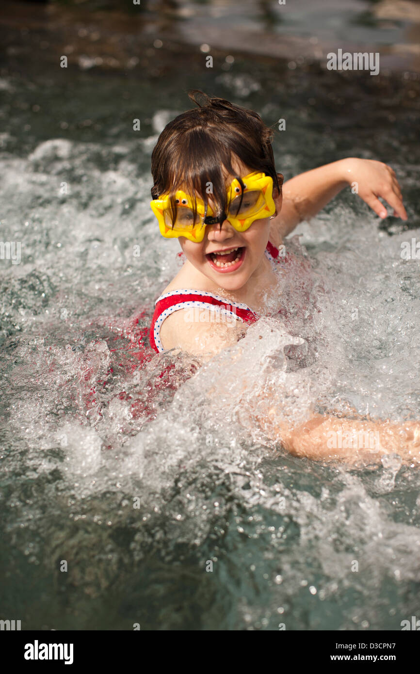 Girl wearing star shaped swimming goggles, Marrakech, Morocco Stock Photo