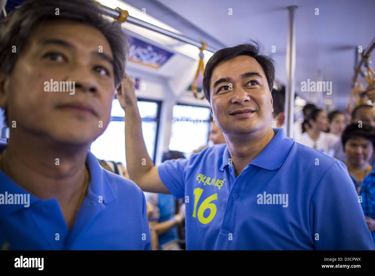 Feb. 16, 2013 - Bangkok, Thailand - ABHISIT VEJJAJIVA, former Prime Minister of Thailand, rides the BTS Skytrain while he campaigns for his party colleague Sukhumbhand Paribatra ahead of Bangkok's governor election. Bangkok residents go to the polls on March 3 to elect a new governor. Sukhumbhand Paribatra, the current governor, is running on the Democrat's ticket and is getting help from national politicians like Abhisit Vejjajiva, the former Thai Prime Minister. One of Sukhumbhand's campaign pledges is to improve Bangkok's mass transit and transportation system. Abhisist road the BTS Skytrai Stock Photo