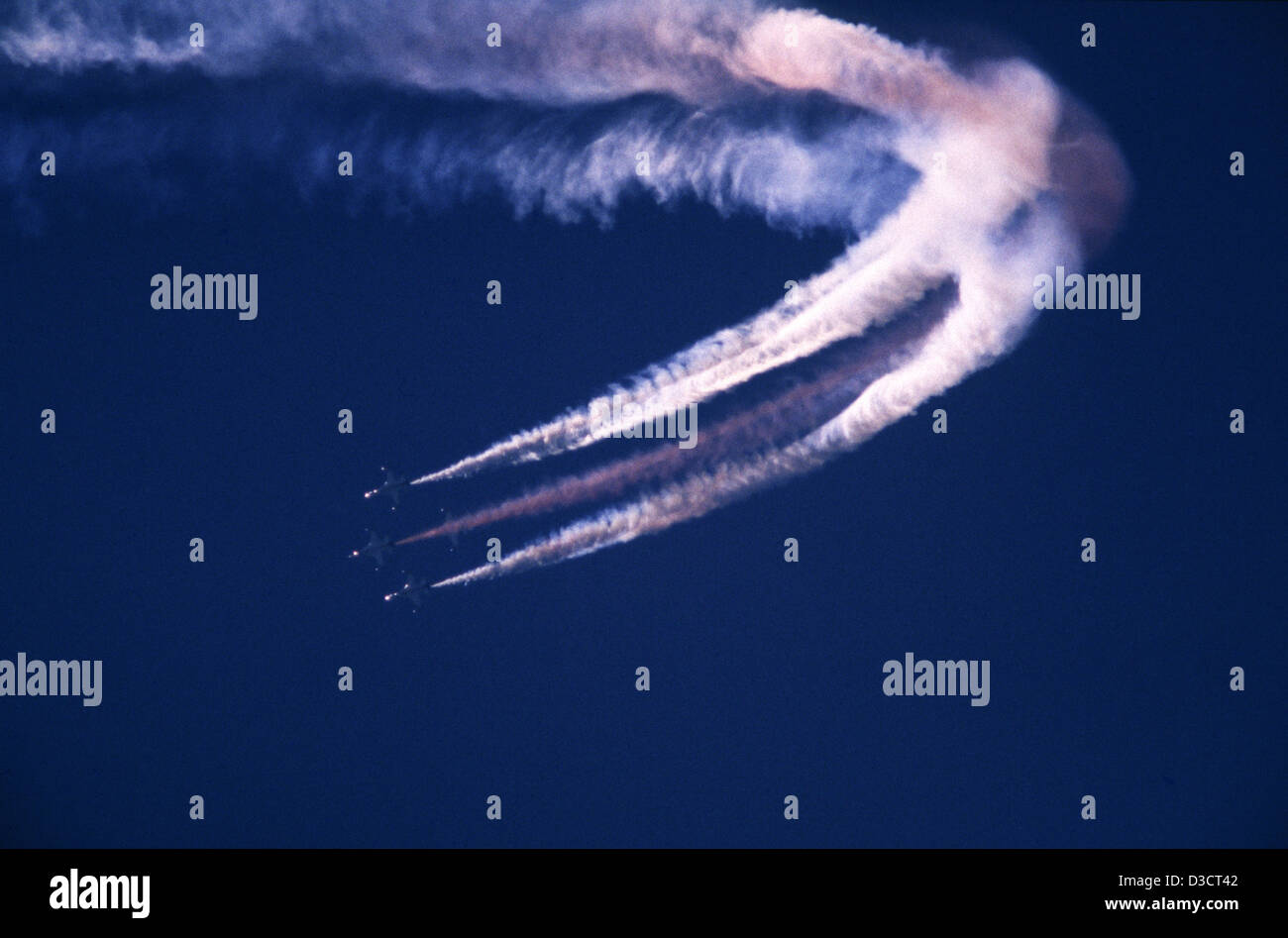 Combat air crafts of the Israeli air force flying in formation and leaving smoke trails in the sky during airshow in Israel Stock Photo