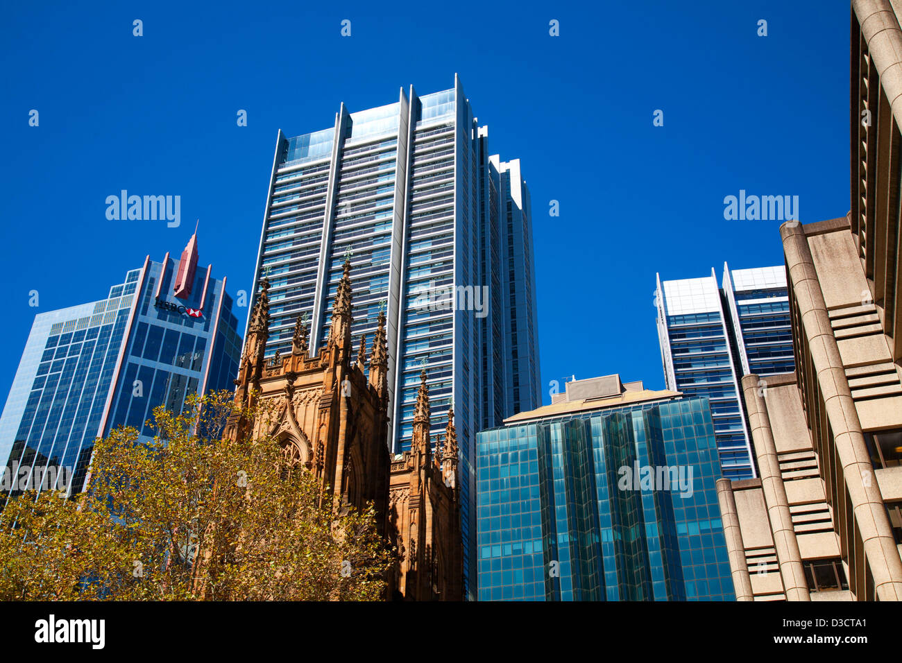 St. Andrew's Anglican Cathedral with modern office building in background Town Hall Square Sydney Australia Stock Photo
