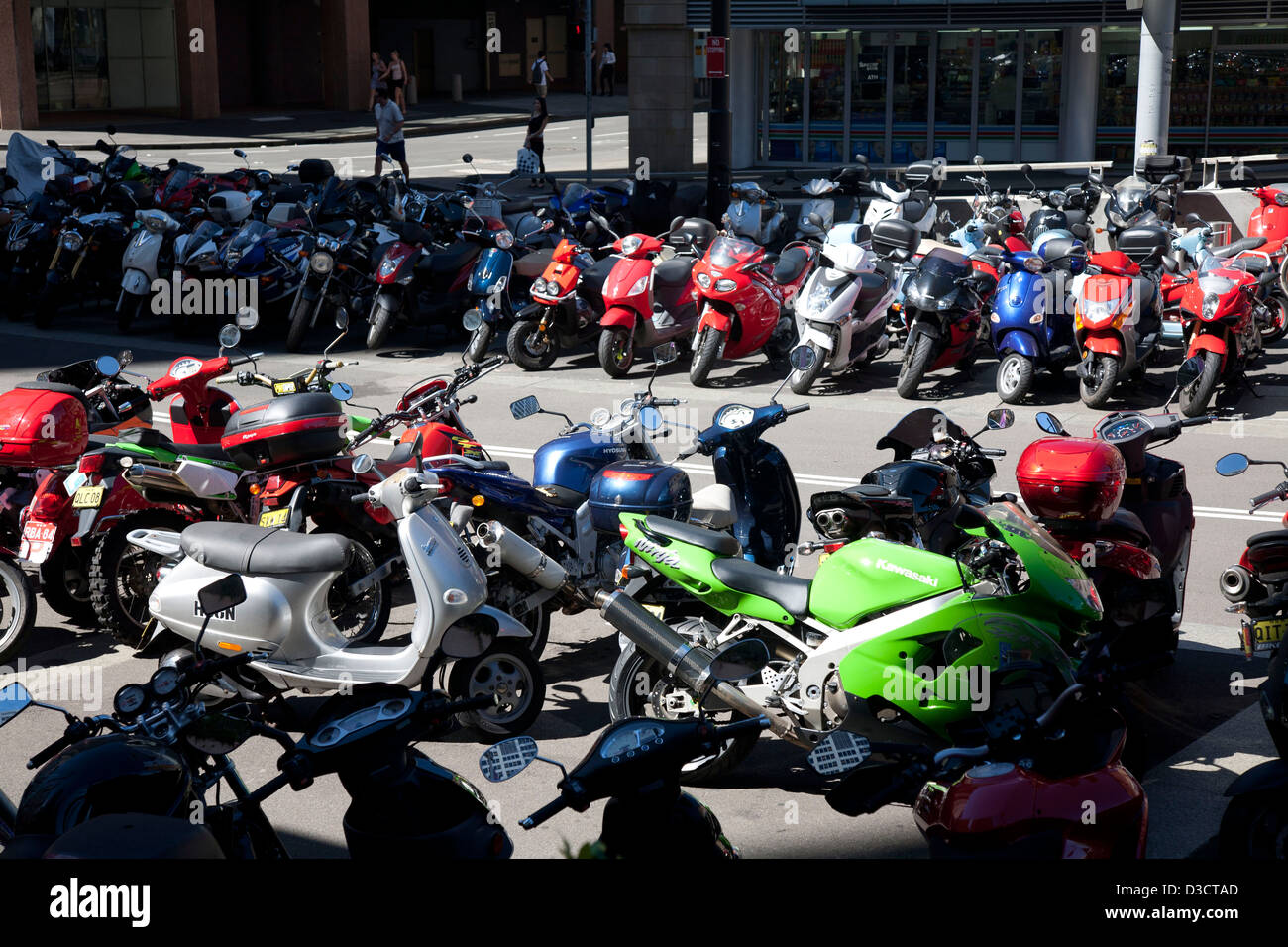 Commuter Motorcycle, mopeds, scooters Parking on King Street near Darling Park Sydney Australia Stock Photo