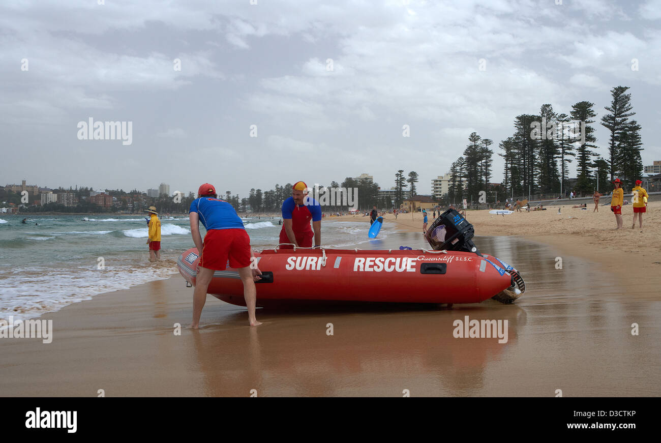 Sydney, Australia, lifeguards on the beach with their boat from Manly Stock Photo