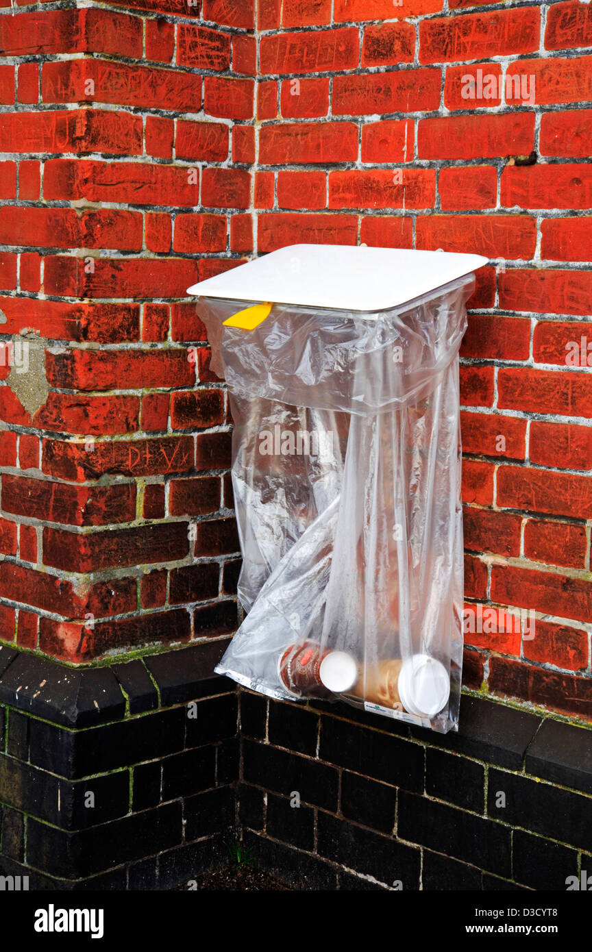 A plastic rubbish bin bag on the railway station platform at Acle, Norfolk, England, United Kingdom. Stock Photo