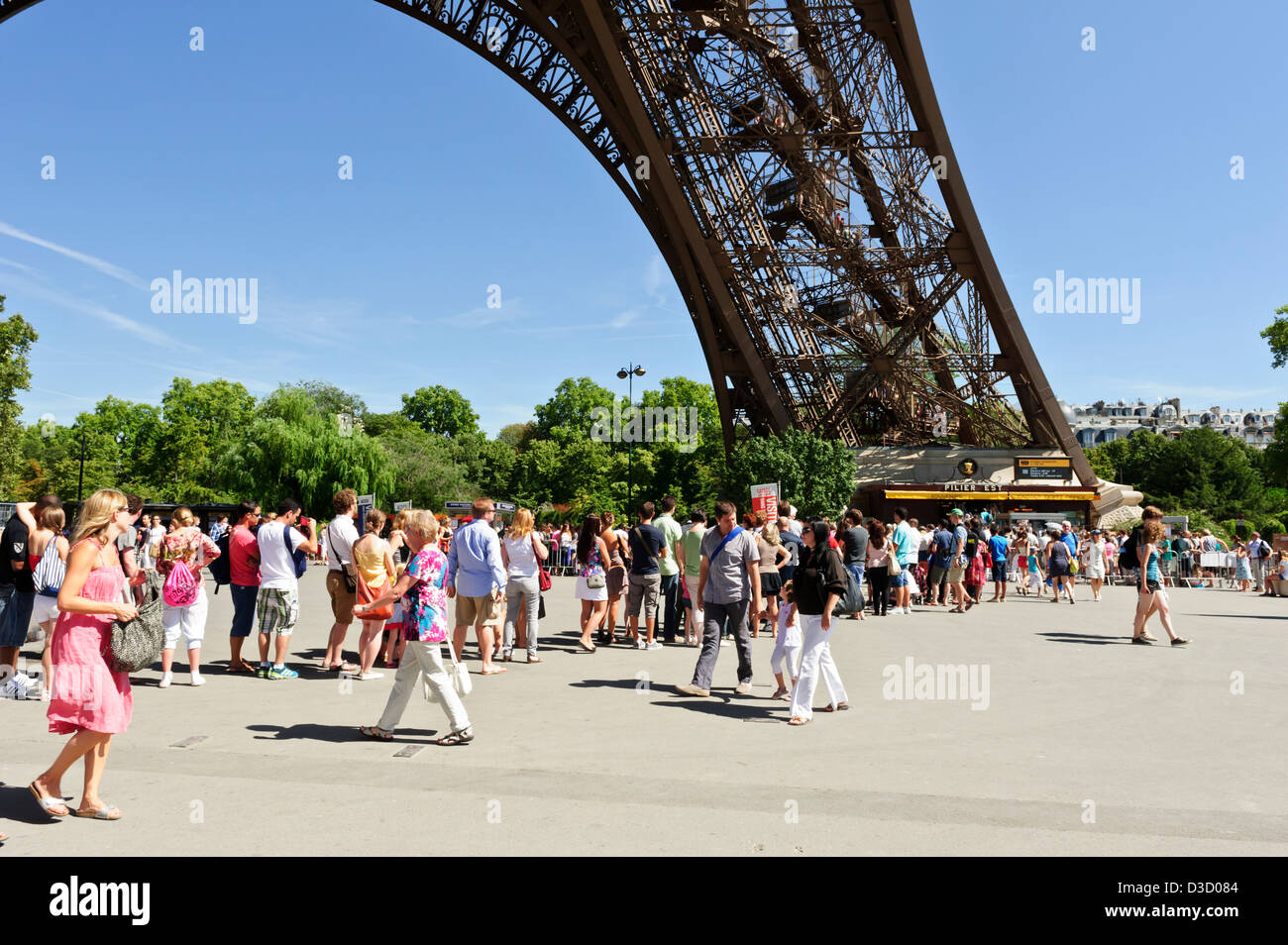 Tourists queuing to buy tickets, Eiffel Tower, Paris, France Stock