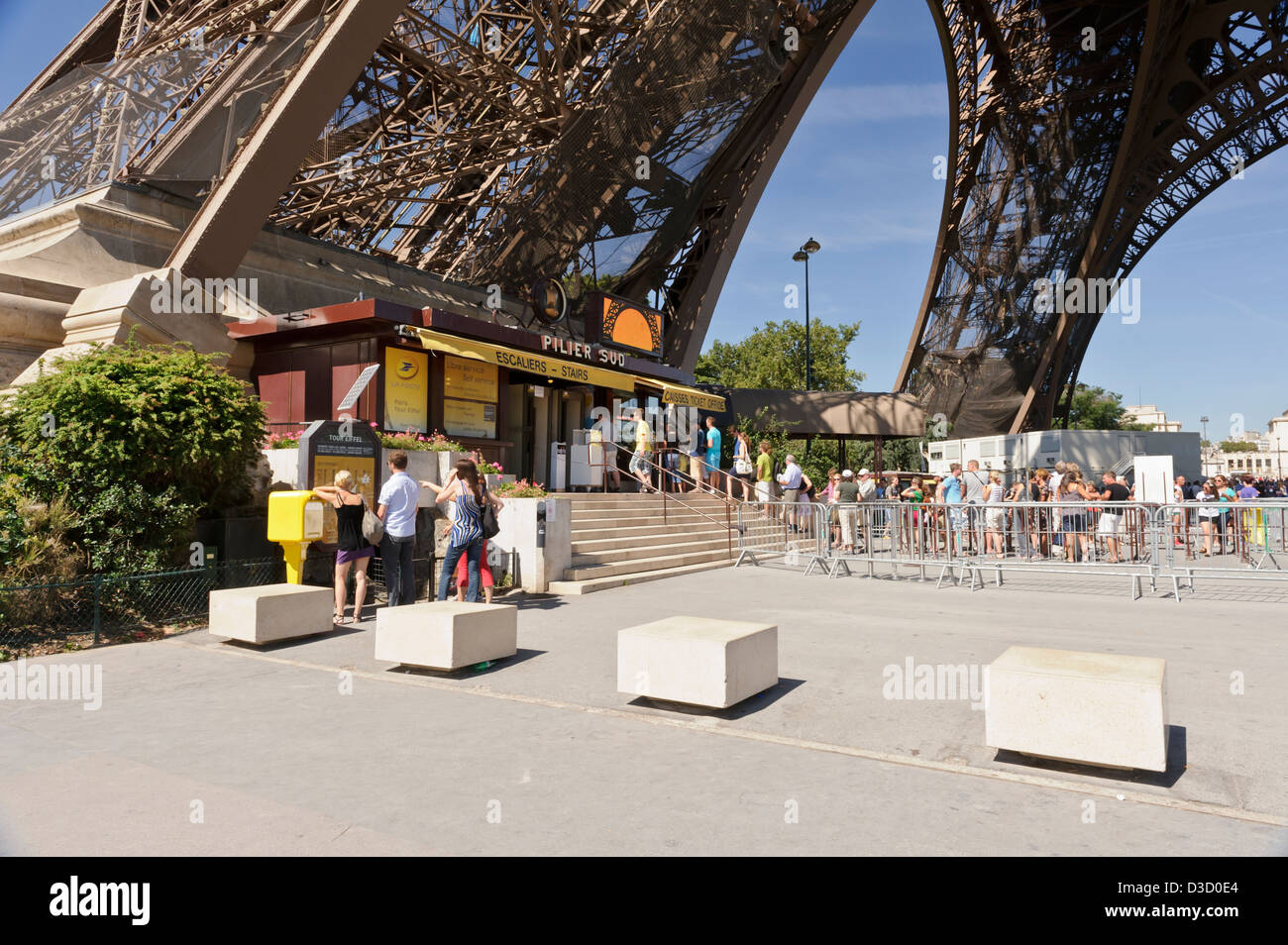 Tourists queuing to buy tickets, Eiffel Tower, Paris, France. Stock Photo