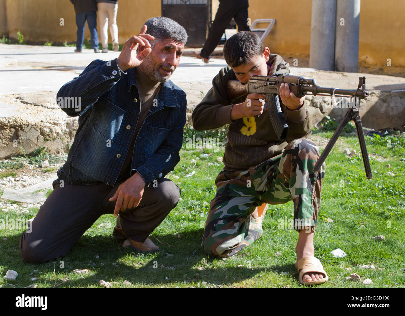 Free Syrian Army youth soldiers attend a training camp in Syria. Their ages range from 14 to 18 and they spend several weeks. Stock Photo