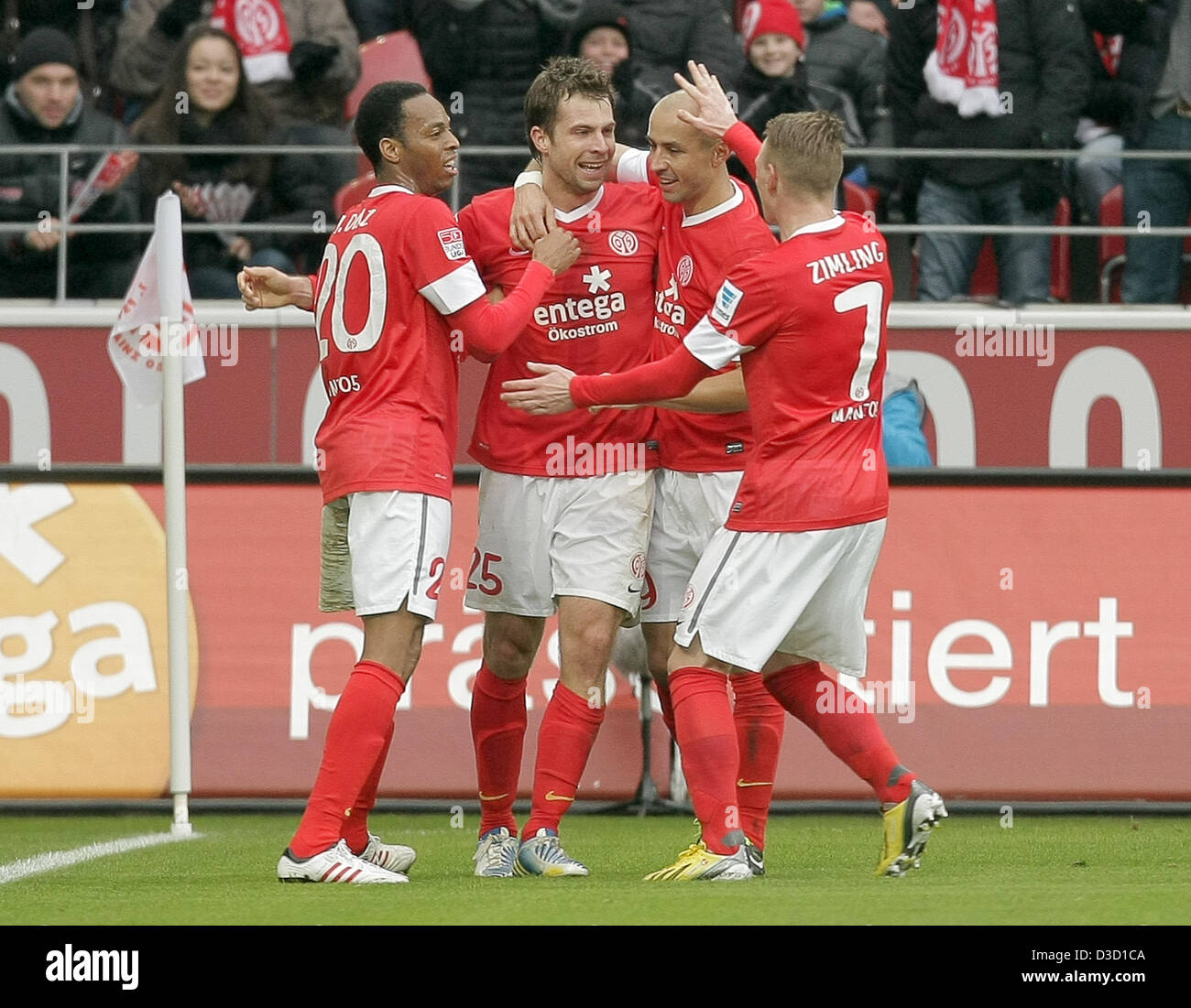 Mainz's Junior Diaz (L-R), Andreas Ivanschitz, Elkin Soto and Niki Zimling celebrate the 1-0 goal during the German Bundesliga soccer match between 1. FSV Mainz 05 and FC Schalke 04 at Coface Arena in Mainz, Germany, 16 February 2013. Photo: FREDRIK VON ERICHSEN (ATTENTION: EMBARGO CONDITIONS! The DFL permits the further utilisation of up to 15 pictures only (no sequntial pictures or video-similar series of pictures allowed) via the internet and online media during the match (including halftime), taken from inside the stadium and/or prior to the start of the match. The DFL permits the unrestri Stock Photo