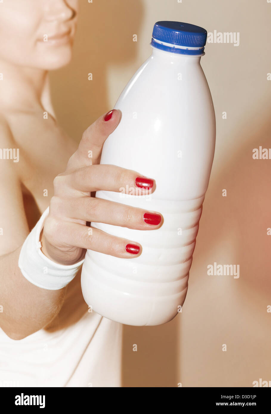 close up of female hand that suggests to take bottle of milk Stock Photo