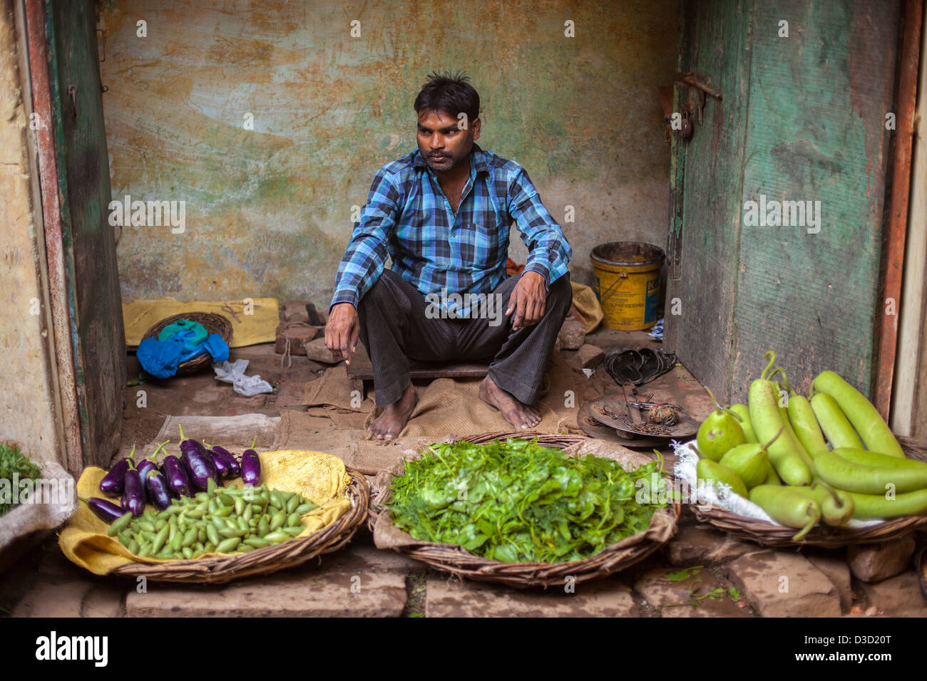 Indian man at a vegetable market, Varanasi, India Stock Photo