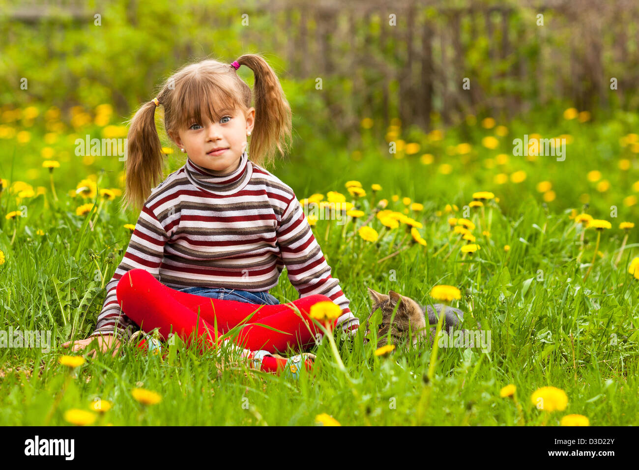 Funny lovely little girl playing in the park Stock Photo - Alamy