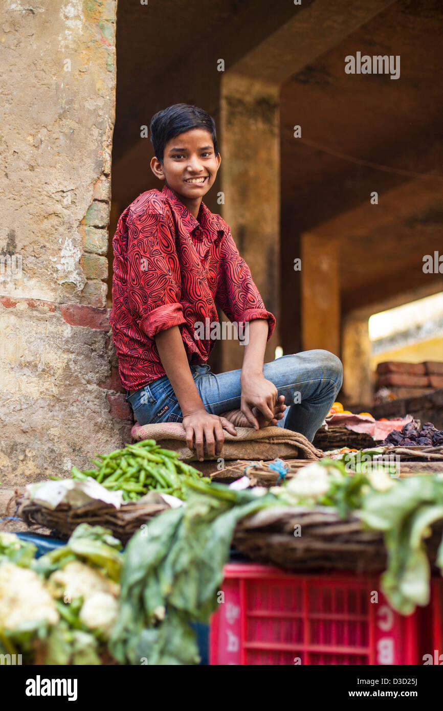 boy selling vegetables at a market, Varanasi, India Stock Photo