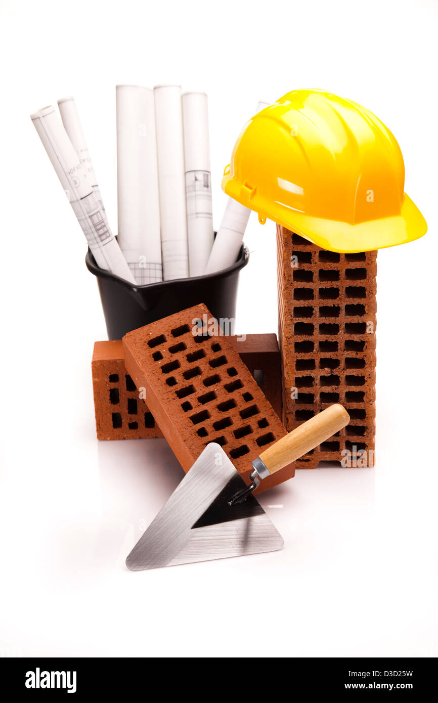 Bricks, trowel tool and Construction plans Stock Photo Alamy