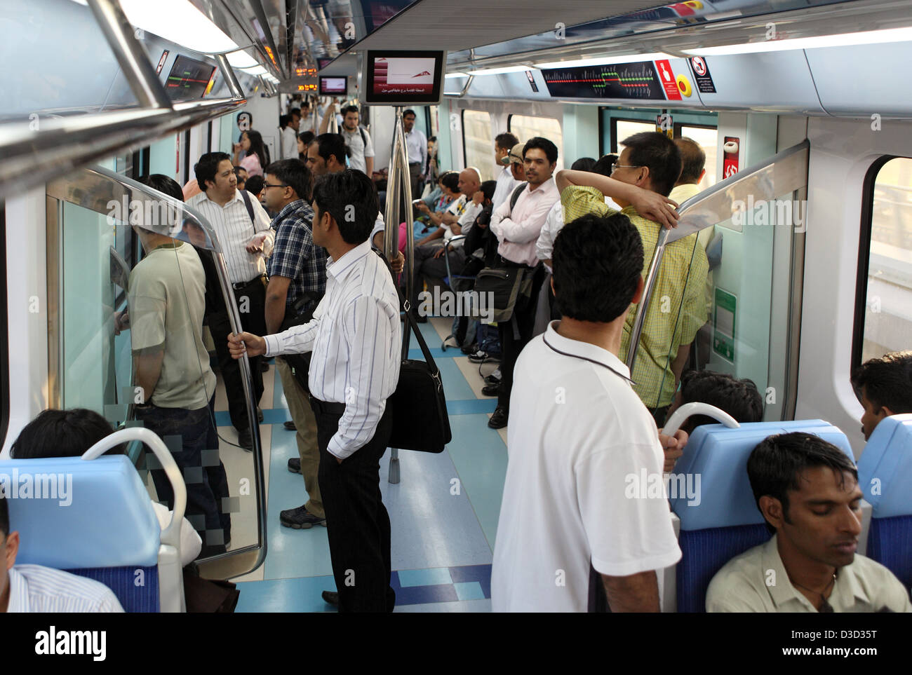 Dubai, United Arab Emirates, people in one compartment of the Dubai Metro Stock Photo
