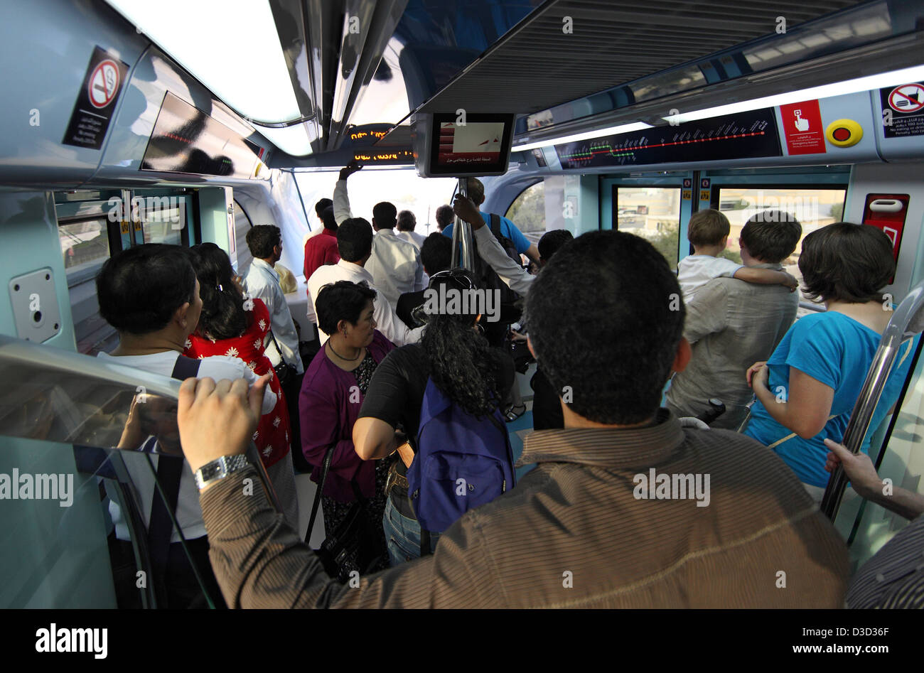 Dubai, United Arab Emirates, people in one compartment of the Dubai Metro Stock Photo