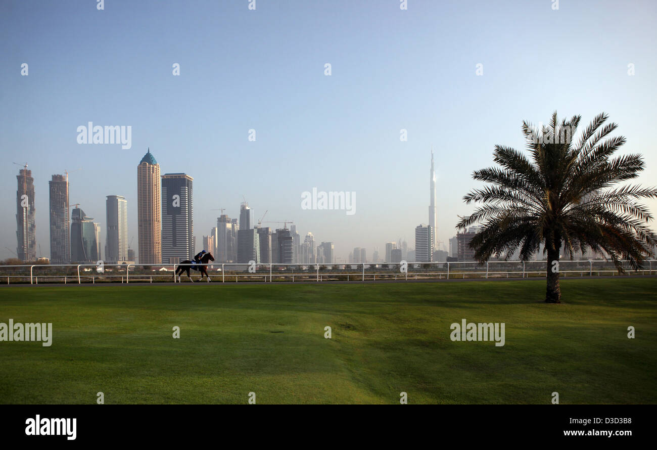Dubai, United Arab Emirates, horse and rider against the skyline with the Burj Khalifa Stock Photo