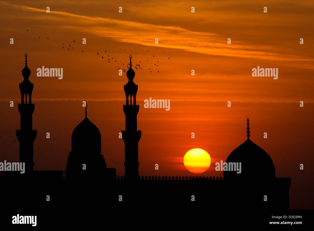 The Sultan Hassan Mosque silhouetted at sunset. Islamic Cairo, Egypt Stock Photo