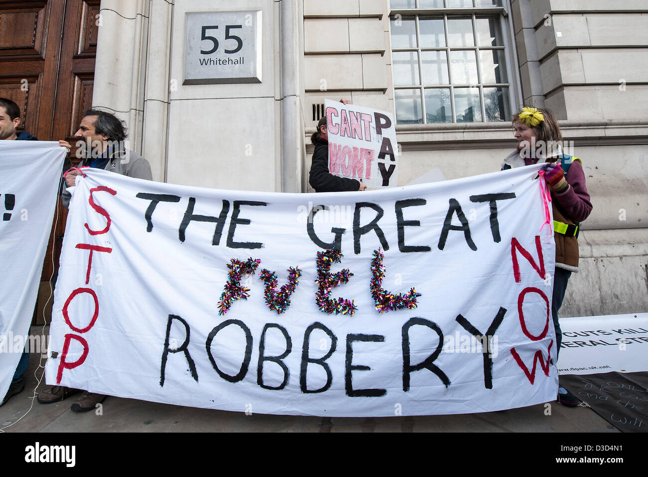 A protest organised by Fuel Poverty Action outside the  Department of Energy and Climate Change as part of a national weekend of fuel bill actions. A mixed group of pensioners, disabled groups and activists trying to reduce poverty gathered under the  ‘Stop the Great Fuel Robbery’ slogan and were complaining against ever increasing fuel bills.  Whitehall, London, UK 16 February 2013. Stock Photo