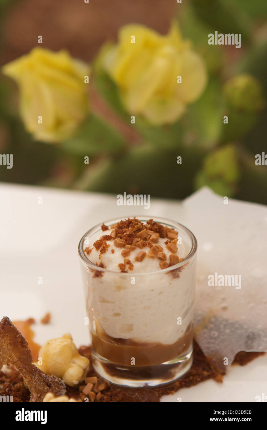 A banana & date parfait served with a date & walnut drizzle Stock Photo