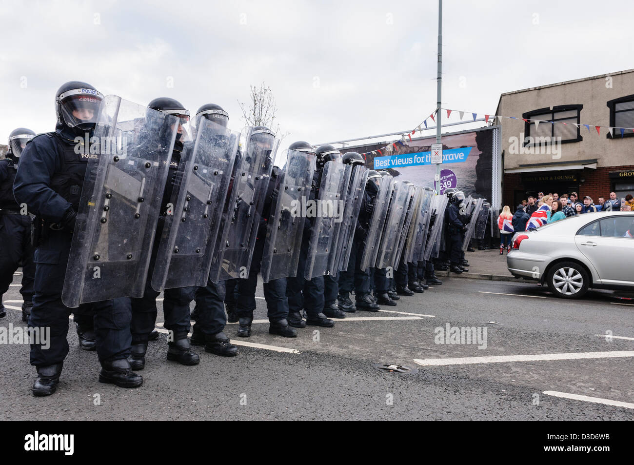 16th February 2013. Belfast, Northern Ireland.  Police dressed in riot gear advance to push a crowd of protesters back. Credit: Stephen Barnes/Alamy Live News Stock Photo