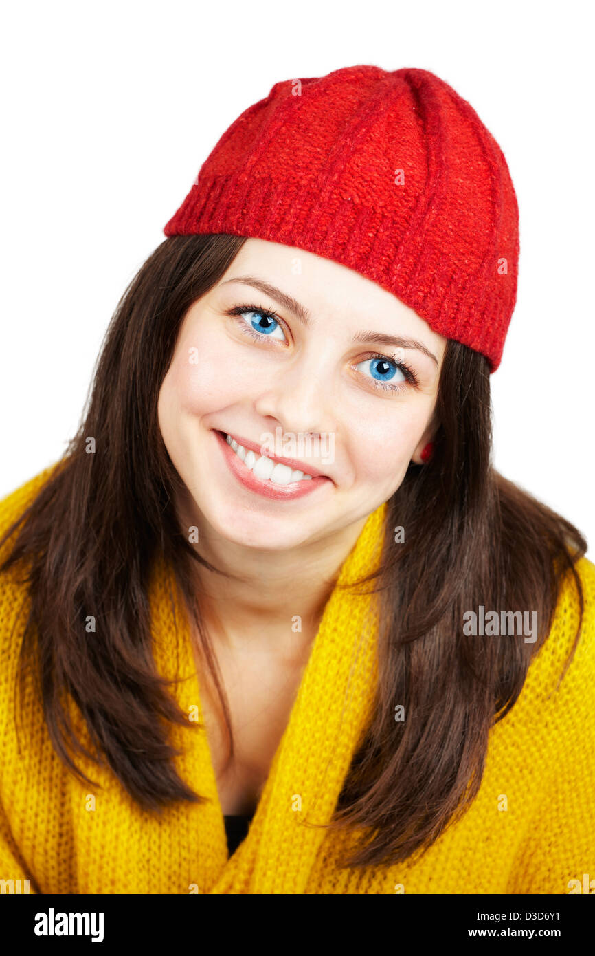 Portrait of a beautiful teenage girl with yellow scarf and red hat over ...