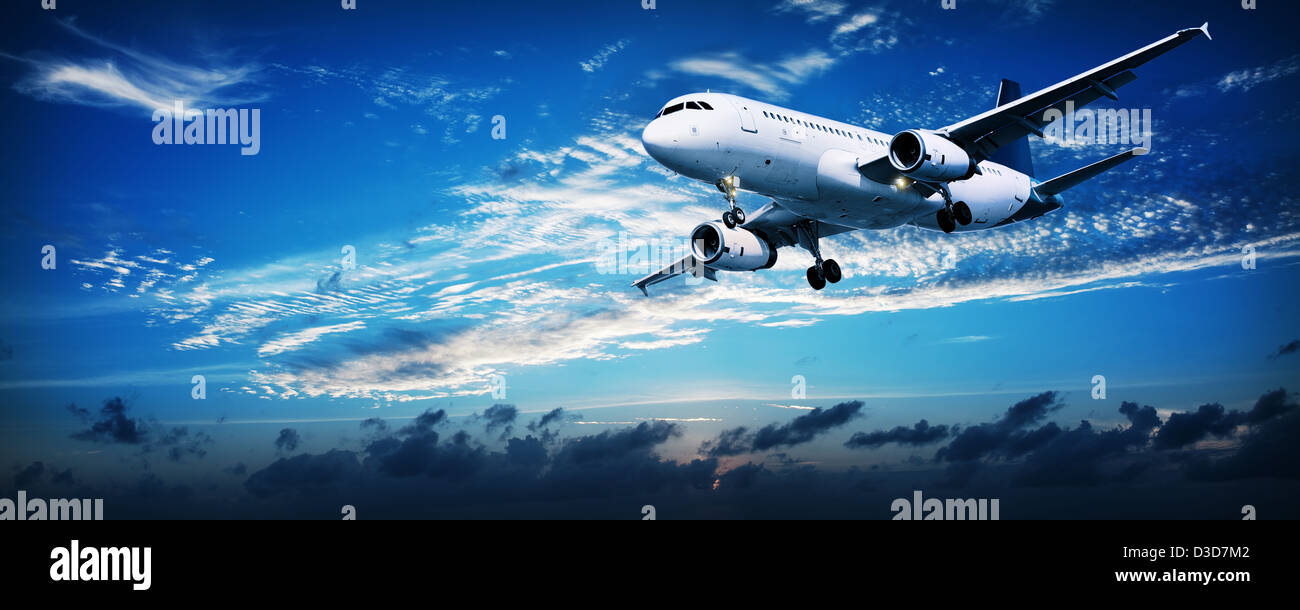 Panoramic composition of a flying jet in a sunset sky Stock Photo Alamy
