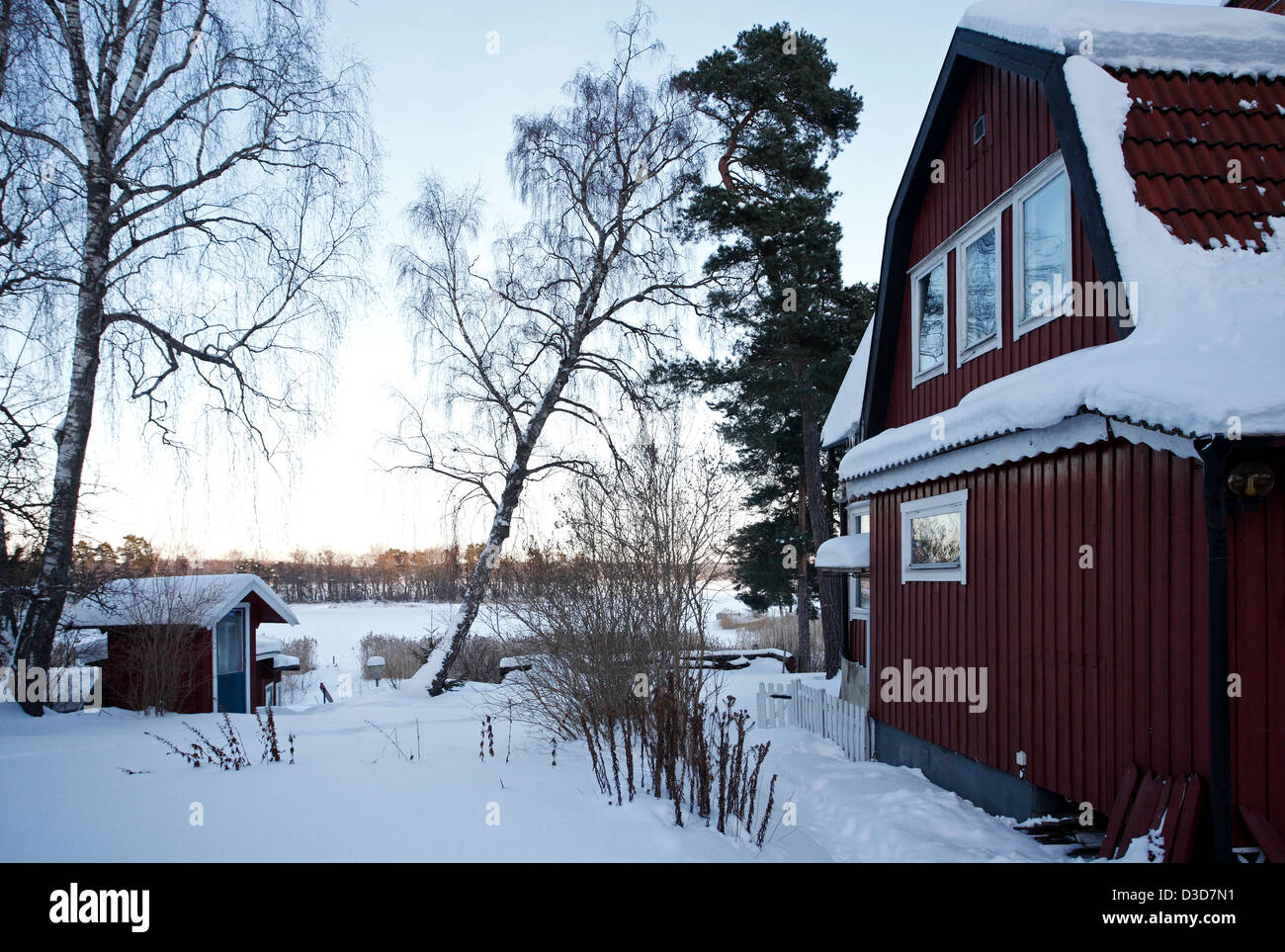 Dill, Sweden, wooden house in the snowbound village Trolldalen Stock Photo