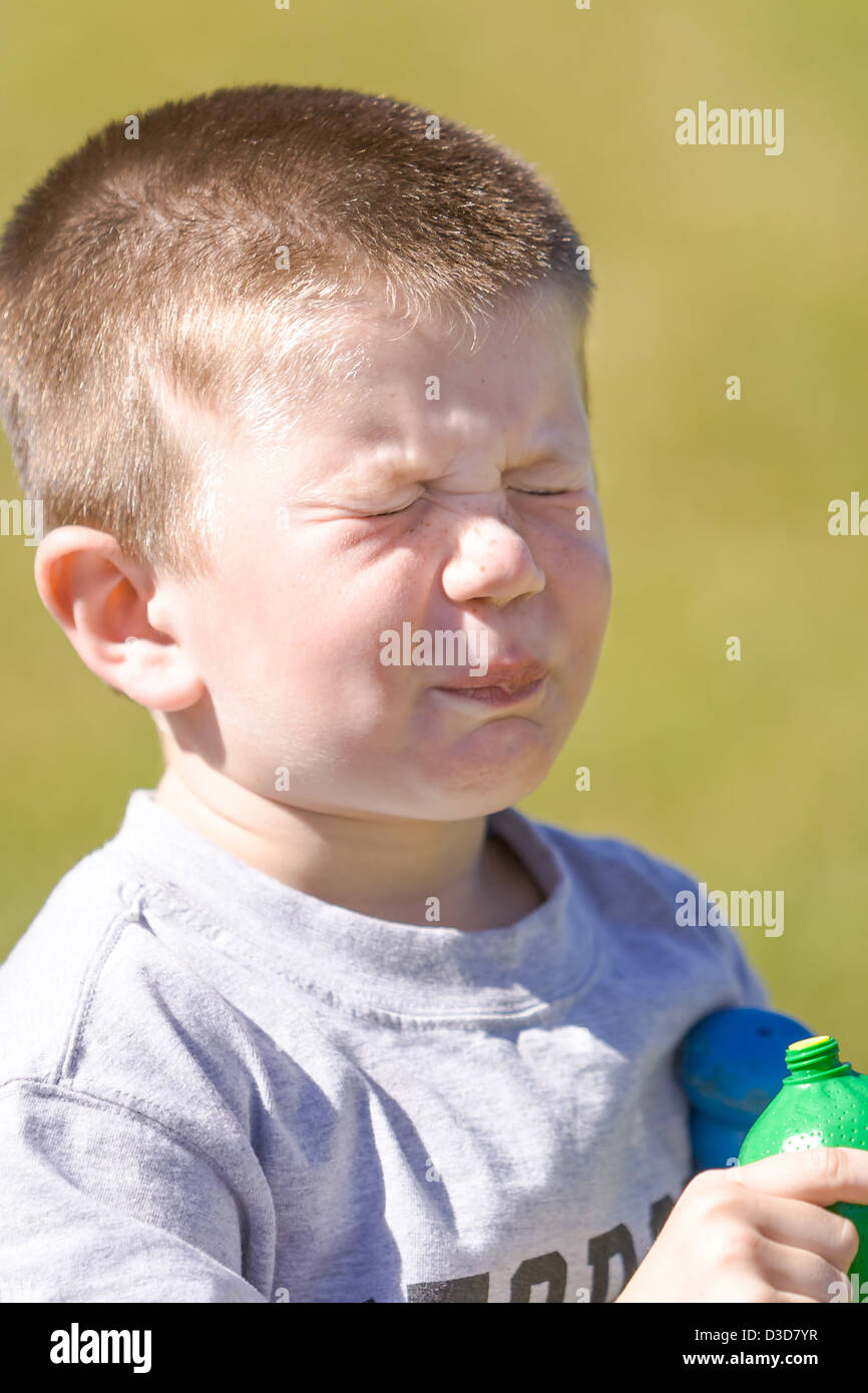 Funny face boy sour hires stock photography and images Alamy