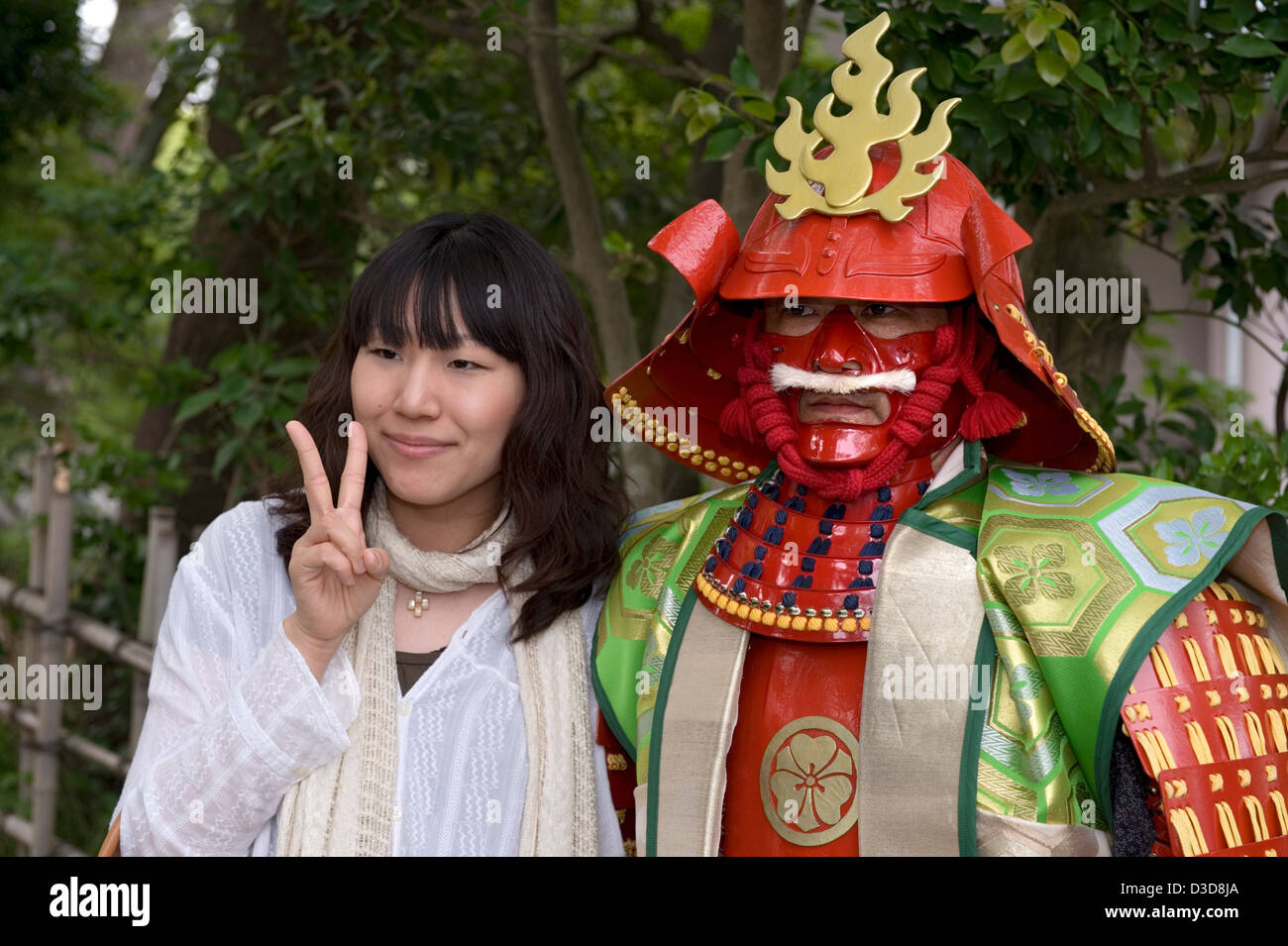 Actor in theatrical-looking, semi-modern samurai costume hired to pose for photos at local festival in Odawara, Kanagawa, Japan. Stock Photo