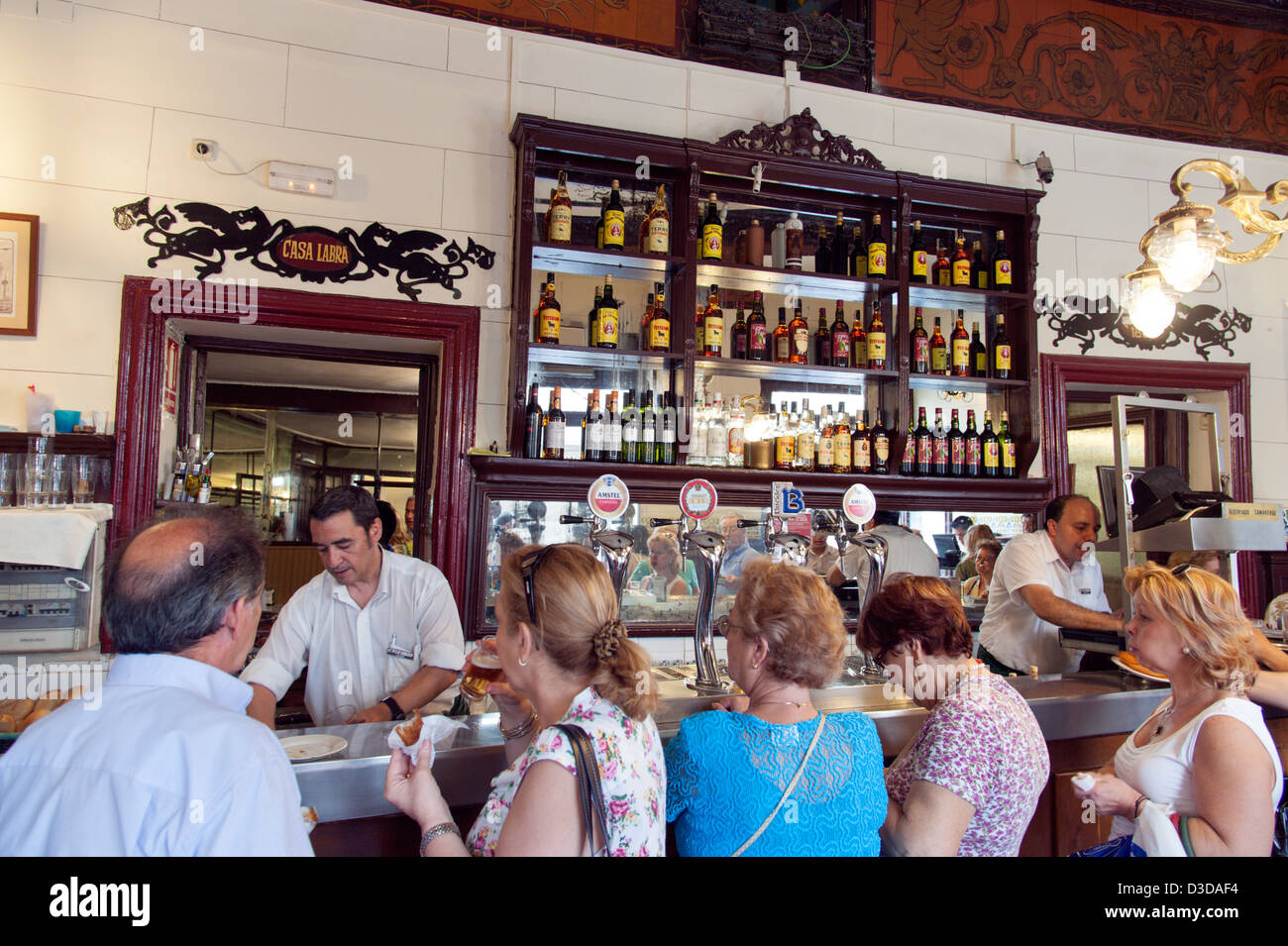 People having lunch time drinks at bar Casa Labra just off Sol, Madrid, Spain Stock Photo