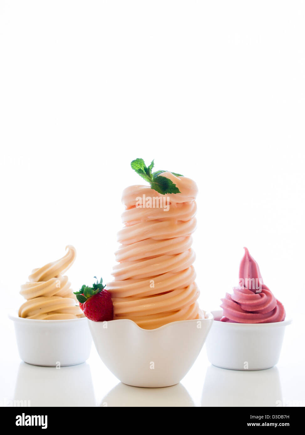 Cup of soft-serve frozen yogurt on white background Stock Photo - Alamy