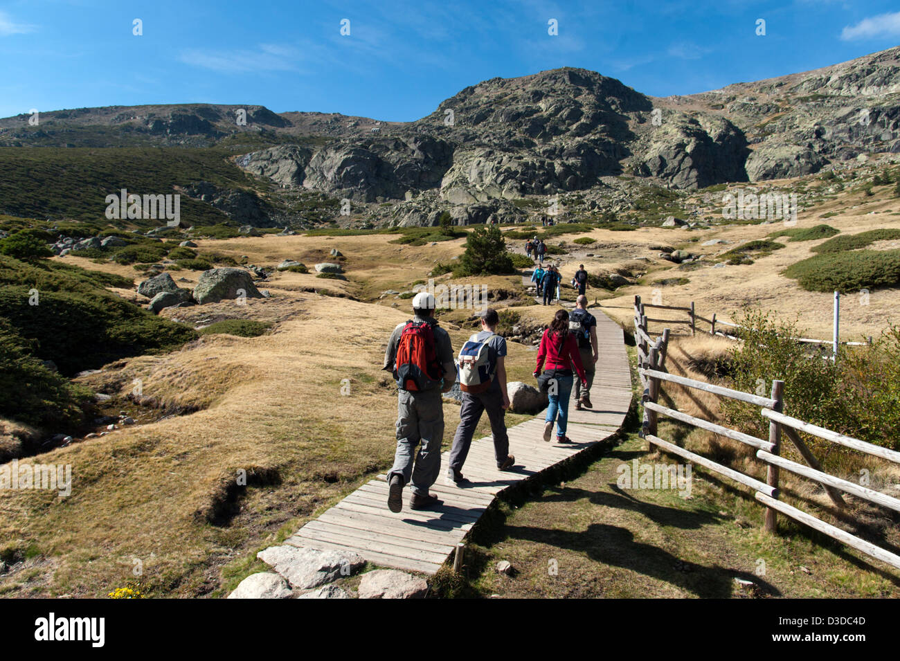 Young people hiking in the Penalara Nature Reserve on the Sierra de Guadarrama, Madrid, Spain Stock Photo