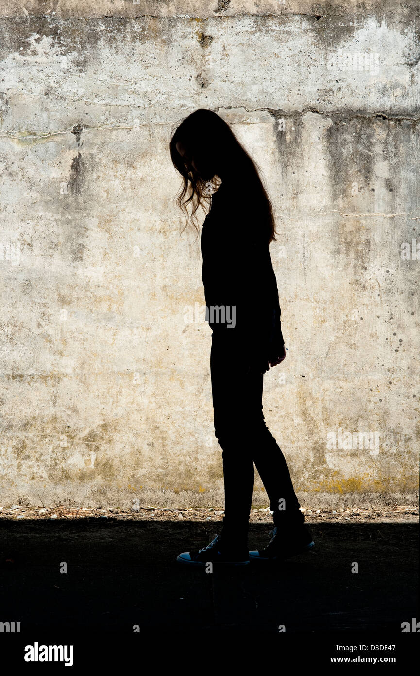Portrait of girl walking in front of a cement wall at Fort Casey State Park Whidbey Island Washington State Stock Photo