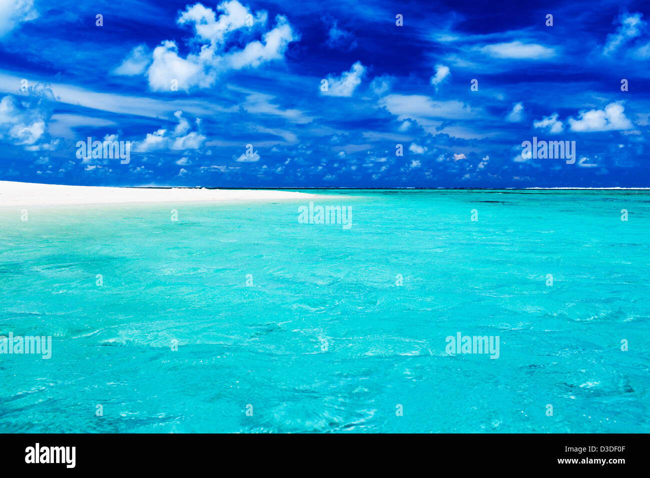 Deserted tropical beach with clear blue water and sky Stock Photo - Alamy