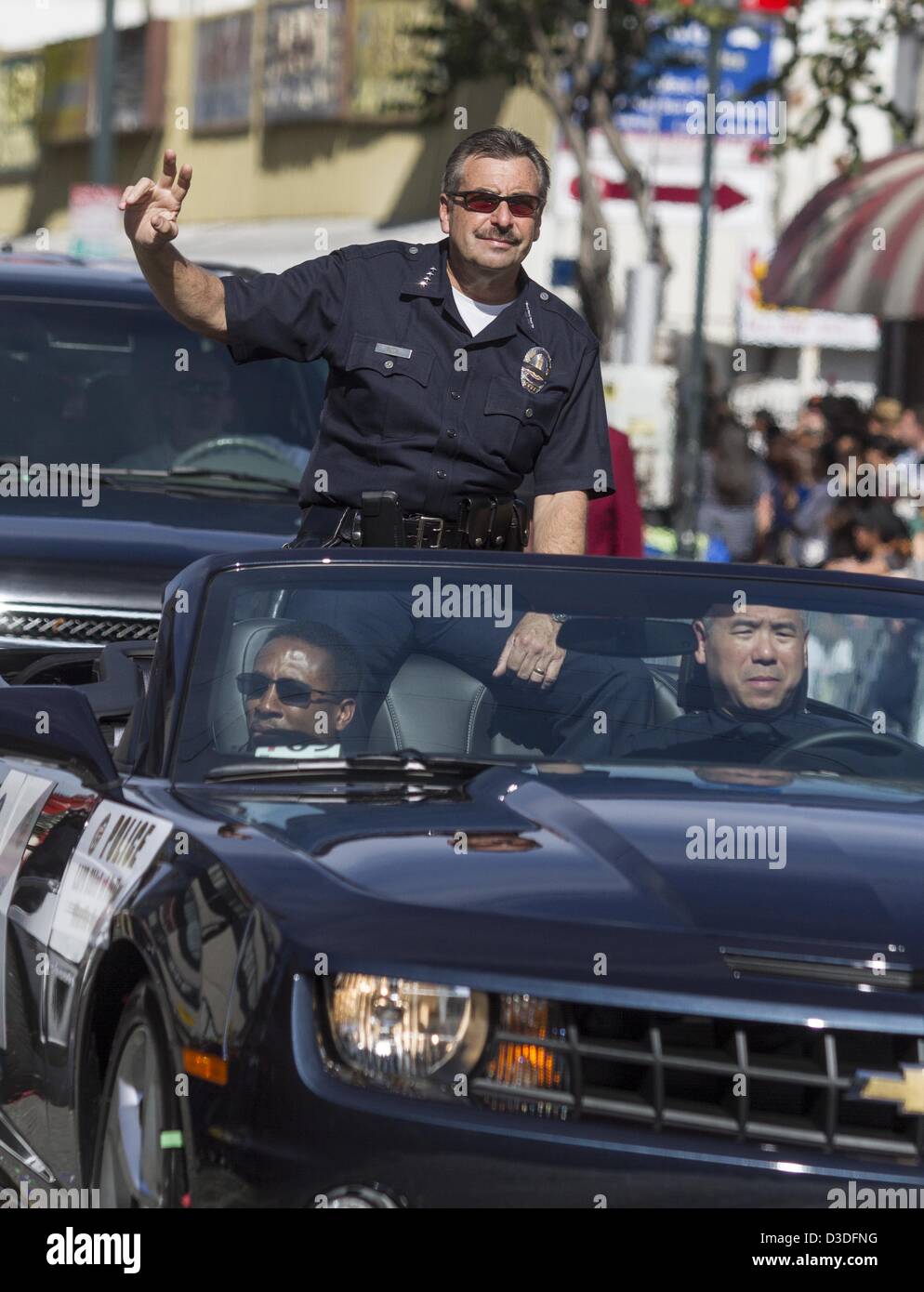 Feb. 16, 2013 - Los Angeles, California (CA, United States - Los Angeles Police Chief Charlie Beck waves during the 114th annual Chinese New Year ''Golden Dragon Parade'' in the streets of Chinatown in Los Angeles, Saturday Feburary 16, 2013. (Credit Image: © Ringo Chiu/ZUMAPRESS.com) Stock Photo