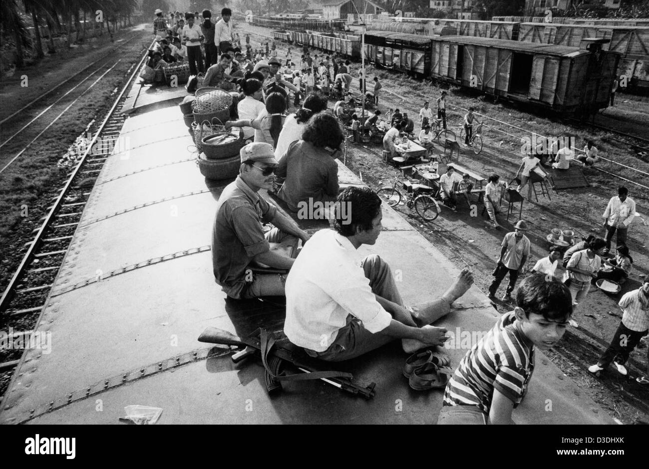 Cambodia: Passengers ride the roof as the crowded train bound for Kampot on the coast prepares to leave Phnom Peh. Stock Photo