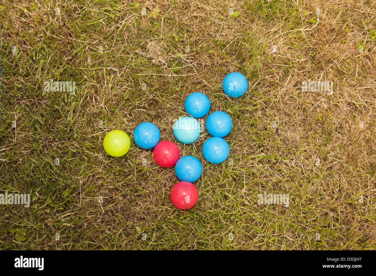 Colorful balls lying on grass in open Stock Photo Alamy