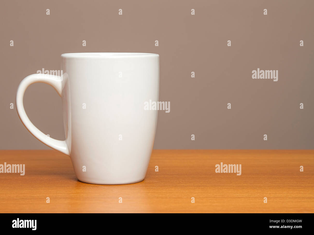 White mug on wooden table Stock Photo
