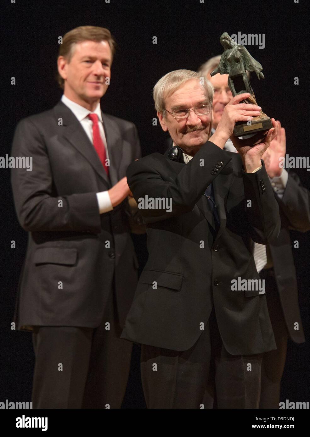 Former Soviet officer Stanislav Petrov holds the 'Dresden Prize' in front of ZDF journalist and laudatory speaker Claus Kleber (L) in the Semper Opera in Dresden, Germany, 17 February 2013. The prize is worth 25,000 euros. The alarm was signalled while he was on duty at the command center for the Soviet Air Defence Forces on 26 September 1983. The 73 year-old judged the alarm to be a false alarm preventing a nuclear attack on the USA. Photo: OLIVER KILLIG Stock Photo