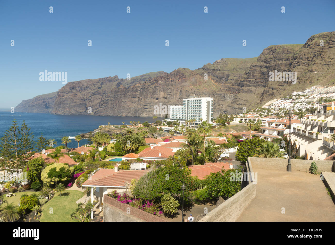 A view of Los Gigantes cliffs showing terraced houses, hotel and the shore Stock Photo