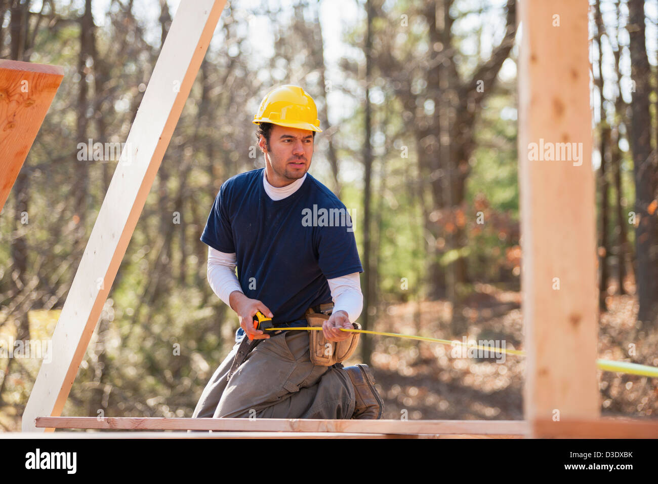 Carpenter measuring rafter length Stock Photo Alamy